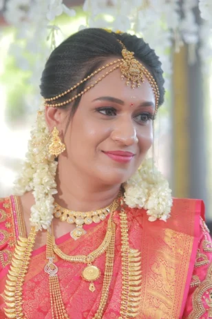 Traditional Indian bride wearing elegant bridal makeup and bridal jewelry.